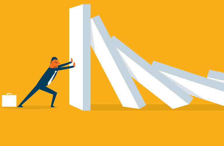 Illustration of a person in a suit stopping falling dominoes, symbolizing preventing a chain reaction or crisis during change in business, with a yellow background.