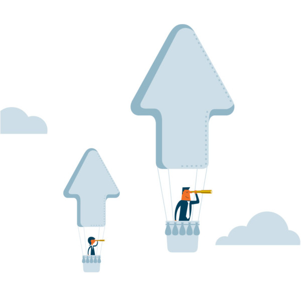 Image of two people in two hot air balloons that are shaped like arrows.