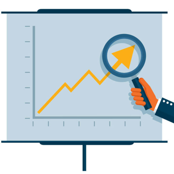 Image of a magnifying glass magnifying a chart of data