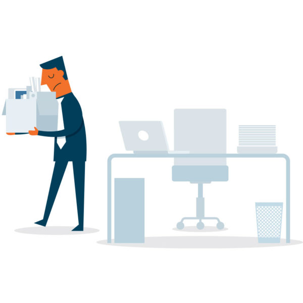 Image of man packing up desk after getting fired