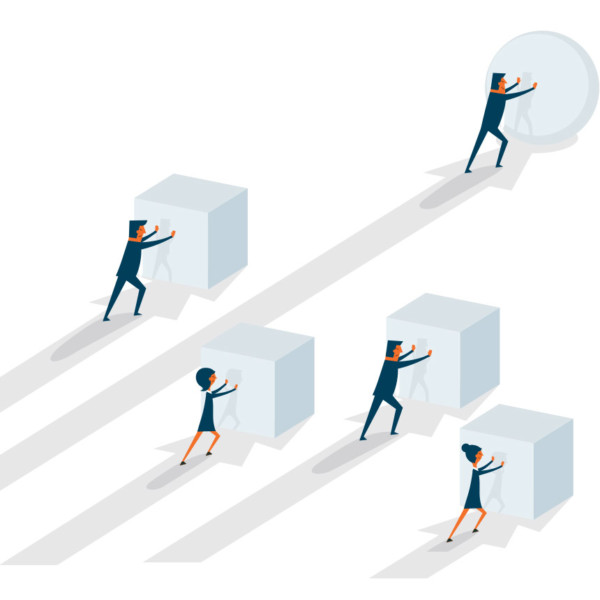 Image of five people pushing large objections.