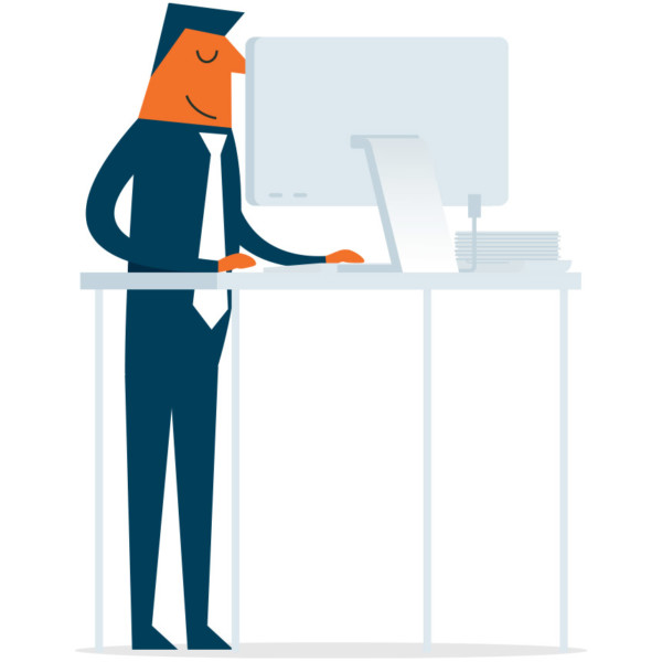 Image of someone working on a standing desk.