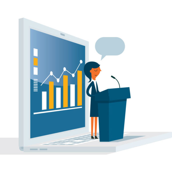 Woman standing on podium explaining success of her small business